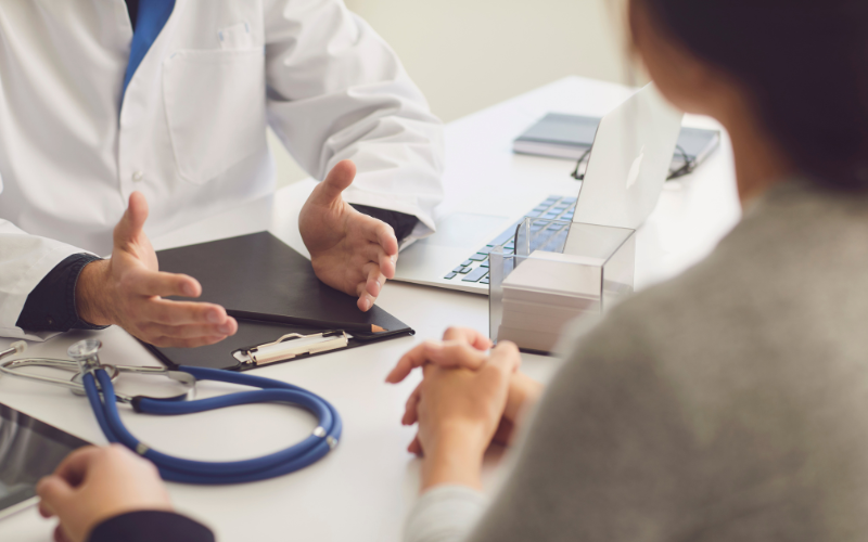 A patient receiving treatment from a doctor