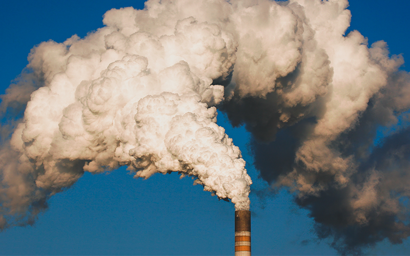 Industrial chimney with smoke coming out