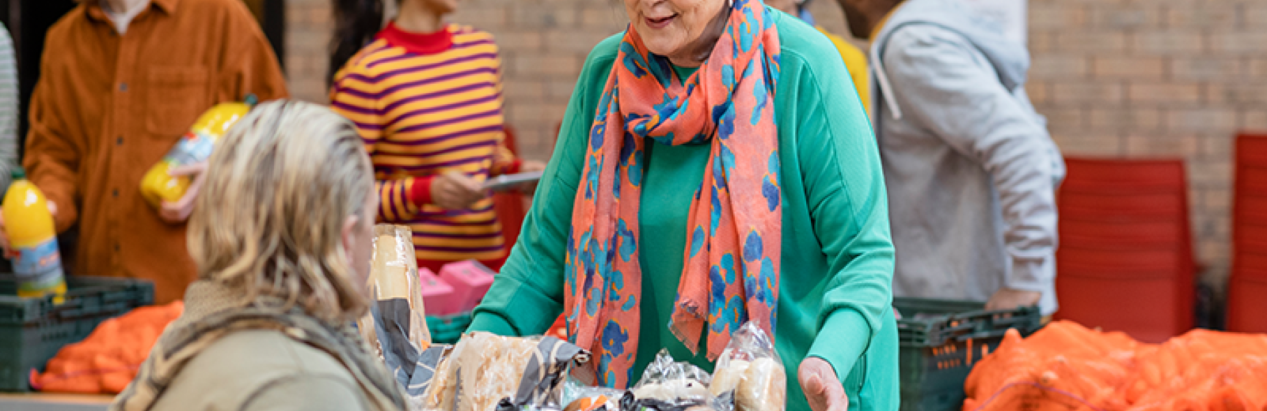 A Woman collecting food from a food bank