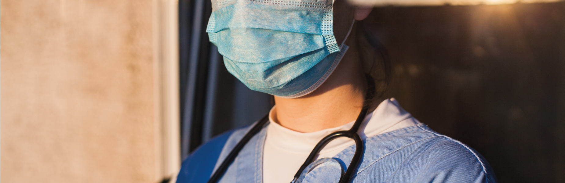 Nurse with mask on and stethoscope around their neck