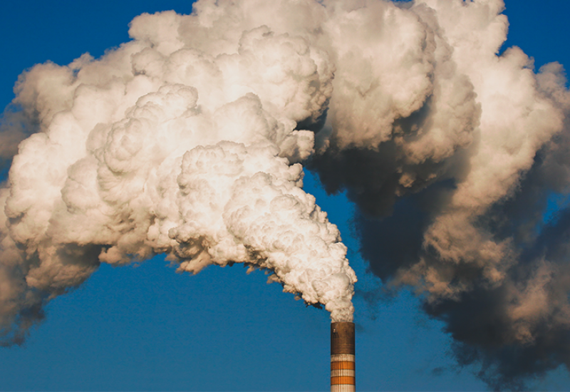 Industrial chimney with smoke coming out
